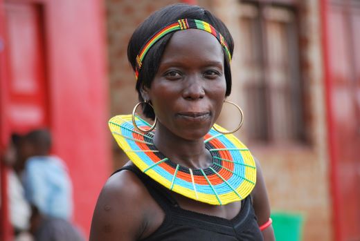 woman wearing black tank top and gold-colored hoop earrings